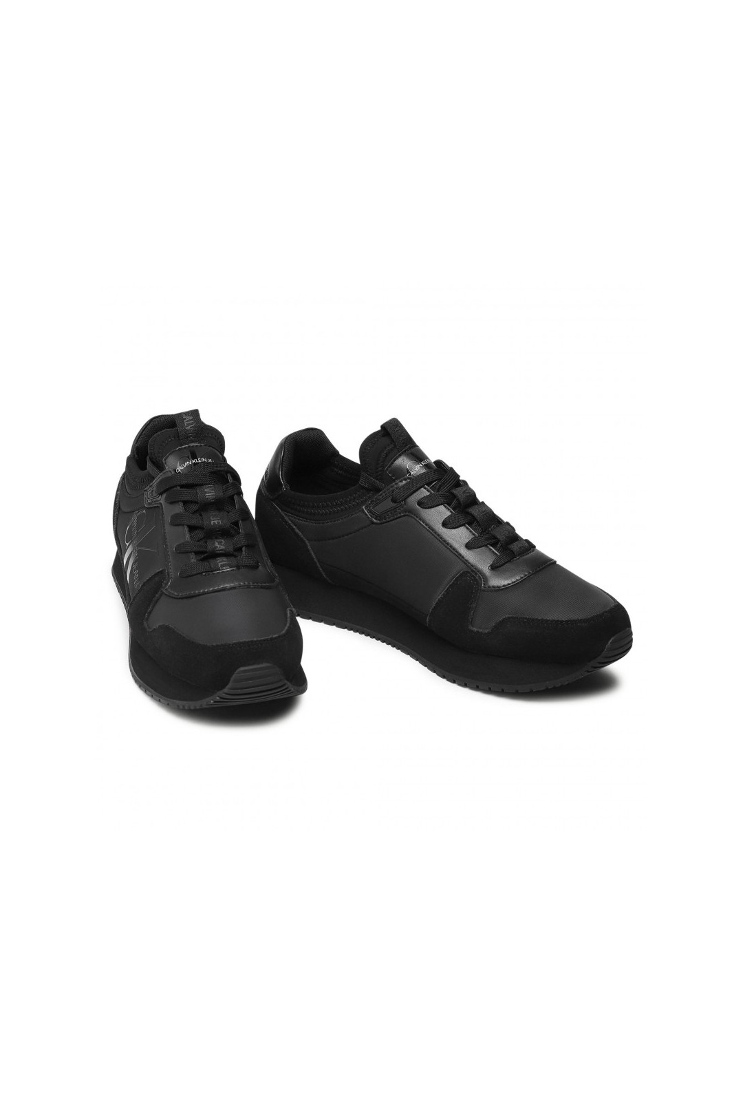 Chaussure mixte sneakers Calvin Klein de couleur noir en daim et simili cuir. YM0YM00040 FIESTA CONCEPT STORE